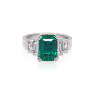 Hand made platinum diamond and colombian emerald cut dress ring